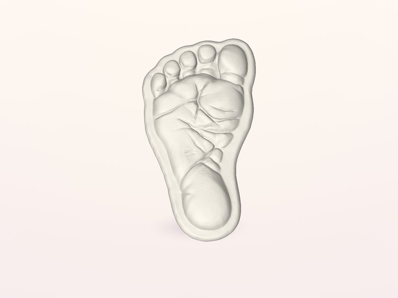 White sculpted Baby Footprint Keepsake, rendered from our accepted test model; top surface without personal lettering